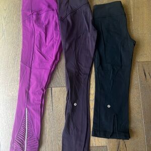 THREE PAIRS lululemon athletica Pink, eggplant, and Black Leggings